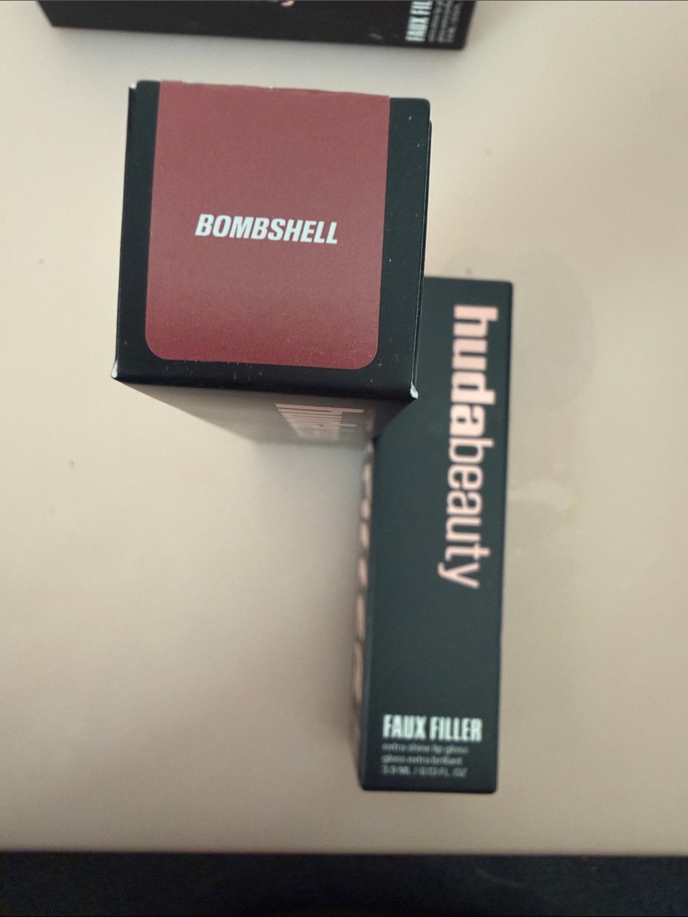 HUDA BEAUTY Faux Filler Lip Gloss – Bombshell